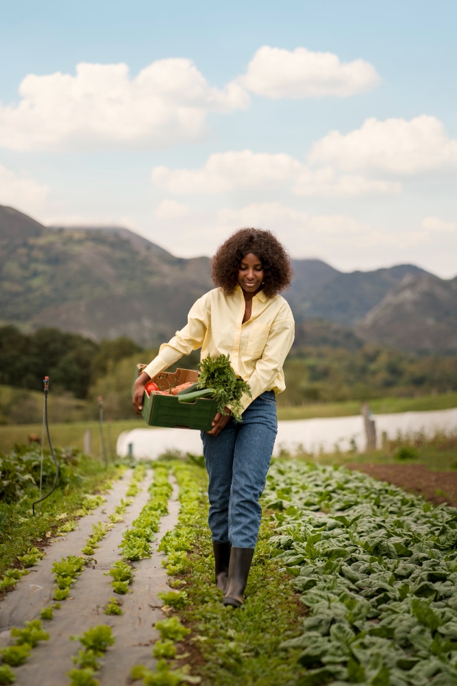 African farmer standing in an agricultural field